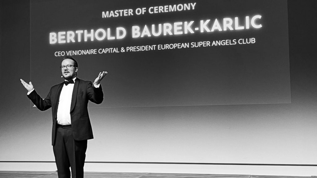 Berthold presenting on stage at the World Venture Forum